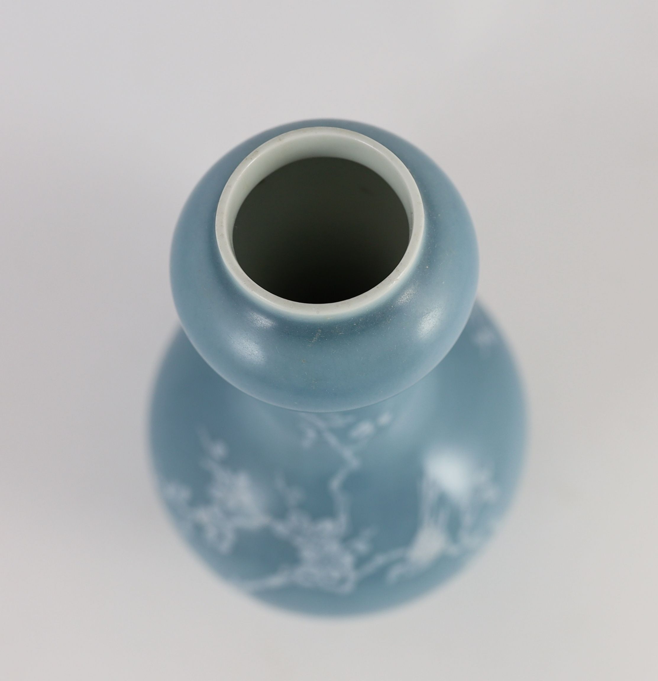 A Chinese claire de lune glazed white slip decorated vase - 25cm high